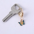 Golden butterfly pendant with blue and yellow enamel details on heart-shaped clasp - Blue Yellow Small Butterfly