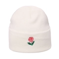 White cuffed beanie hat featuring a vibrant red rose flower embroidery for a soft hip hop style - Rose Embroidery / White