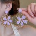 Close-up of purple woven tulle flower earrings with gold metal frame on a female model - Purple Woven Hollow Metal Flower (11# Silver Earring Post)