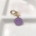 Golden alloy keychain featuring a purple enamel smiley face pendant with a D-ring clasp - Round Face Single Purple