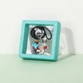 Cyan floating jewelry display box with a colorful gemstone pendant necklace inside - Teal Blue