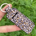 Handheld leopard print keychain lipstick holder with silver ring and soft fabric texture - Light Brown Leopard