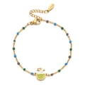 Dettaglio macro del bracciale in acciaio inossidabile dorato con ciondolo di cocco tropicale - Azzurro (SL1040-LLB)