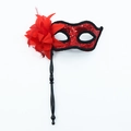 Elegant red masquerade mask with sequins, feathers, and a black handheld stick handle - With Handle / Red