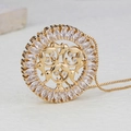 Macro view of 18k gold plated round pendant with marquise zircons and family silhouettes - 3 Girls (NB09-6)