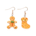 Asymmetric Christmas gingerbread man and stocking dangle earrings in festive orange and gold - Asymmetric Resin Gingerbread Man Earrings