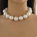 Elegant large pearl choker necklace with gold crystal spacers worn by a model - Round Large Pearl with Rhinestone Spacer Style (5205) / Gold