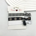 Close-up of three DIY hair bands featuring houndstooth pattern and golden snowflake pendant - Snowflake Print (5)