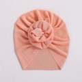 Pink infant turban hat with a stylish donut knot made of soft ribbed knit fabric - Flesh Pink