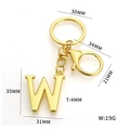 Golden metal letter W keychain with large ring and lobster clasp on white background - Letter W