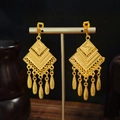 Detail of bohemian gold drop earrings with geometric diamond shapes and leaf tassels - Gold Geometric Rhombus Leaf