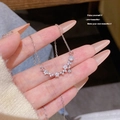 Silver star-shaped titanium steel necklace with zircon stones in a hand-held display - X622 Silver Star Inlaid Zircon