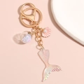 Gold mermaid keychain featuring pink shell with pearl and iridescent sequin fish tail - Iridescent Sequin Ball Shell Mermaid Tail Style (E4952)