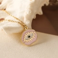 Pink evil eye pendant necklace with gold chain on a white seashell background - Pink (Irregular)
