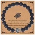 Lucky turtle charm bracelet with 8mm black volcanic lava stone beads on card - Lava Stone