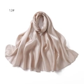 Detail of champagne satin scarf showing smooth silky texture and soft glossy sheen draping - Champagne