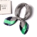 Elegant silk scarf featuring green and blue color blocks with houndstooth patterns - Navy Green Border