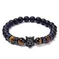 Macro view of wolf head bead bracelet with tiger eye stones and matte black beads - Yellow Tiger Eye Style