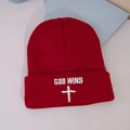 Red knit beanie with white GOO WINS embroidery and cross symbol on plain background - One Size / Burgundy