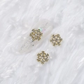 Golden alloy snowflake nail art charms with crystals on silver glitter white nails - Style A1143-17
