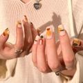 Matte press-on nails featuring red and green geometric abstract patterns on hands - Matte Abstract Geometric Style (JP1611)