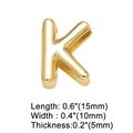 Macro shot of 18K gold plated letter K charm with precise dimensions 15mm by 10mm - Letter K