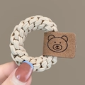 Elastic beige woven hair tie with a brown minimalist bear leather tag detail - Beige Braided Hair Tie with Bear Tag 1Pc