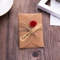 Brown kraft envelope with red paper flower and 'Especially for you' tag on wood - 02 Wine Red Rose