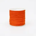 Detailed view of 0.8mm orange nylon cord on a spool for DIY jewelry and knotting - Color 172 Gold