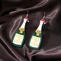 Detail of creative champagne bottle earrings with Fizz The Season text and glitter finish - Green & White Bottle (Silver Hook)