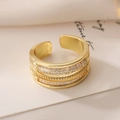 Verstelbare vergulde meerlaagse ring met zirkonia pavé en kralenrand afwerking - Meerlaagse Pave Stijl (13976)