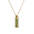 Close-up of golden necklace with cylindrical glass pendant filled with green crystals - Gold Green Stone
