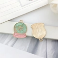 Detail of crystal ball charm with green oil drop finish and gold snowflake pattern - Round Crystal Ball