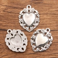 Silver Halloween heart charms with ornate filigree borders on wood background - 27B2-9 Hollow Pattern Heart