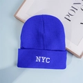 Close-up of bright blue beanie with white NYC embroidery on the folded cuff - One Size / Blue