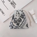 Detail of drawstring storage bag with classic black paisley pattern on soft cotton fabric - White Paisley (Small)