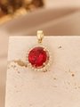 Macro shot of gold four-prong pendant with red round zircon and white halo stones - Pendant Only (Without Chain) / Gold Magenta