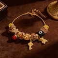 Gold charm bracelet featuring leopard print beads and diverse pendants on brown velvet - Leopard Retro Style (7105)