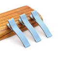 Three light blue grosgrain ribbon wrapped alligator hair clips on a wooden base - 5CM Ribbon Wrapped Clip / Blue