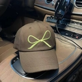 Detail of light green bow embroidery on a brown twill cotton baseball cap - Coffee