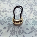 U-shaped hair tie with curved golden alloy metal accent on black elastic cord - Gold Small