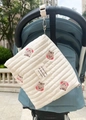 Quilted cotton diaper bag with bear embroidery hanging on a blue baby stroller - Squirrel Head