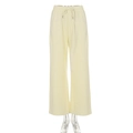 Detail of high-waist yellow wide-leg trousers with elastic drawstring waistband and knit texture - S / Apricot