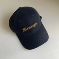 Detailed view of Hiranga golden embroidery on a black cotton twill baseball cap - M (56-58cm) / Navy Blue