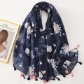 Navy blue floral scarf with light pink patterns and elegant fringe details on white surface - C1215 Navy Contrast Tassel Floral
