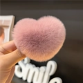 Close-up of a soft pink plush heart hair clip showing its fluffy faux rabbit fur texture - Dusty Pink