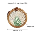 Handmade seashell crossbody bag with tropical leaf pattern, 20cm round rattan woven design - Seaweed Shell