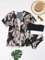 Details des dreiteiligen Bikini-Sets mit tropischem Print-Überwurf und schwarzem Bandeau - S / Schwarz und Rostbraunes Blatt