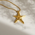 Close-up of golden starfish pendant with twisted rope chain on sunlit beach background - Necklace (50+5cm)