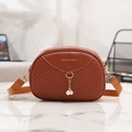 Tan quilted shell crossbody bag with decorative pearls and golden fashion lettering - Tan
